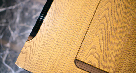 Empty rough wooden table top in the dark room