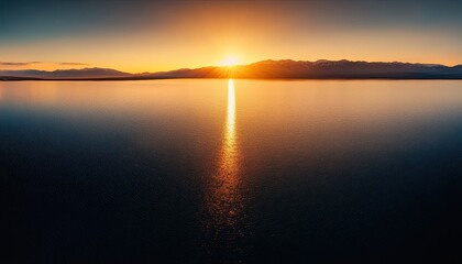 Naklejka premium Sunset over Lake , panoramic view of the lake with mountains in background