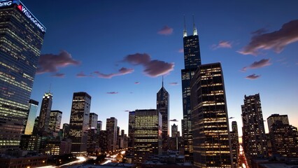 A city skyline at dusk with many tall buildings. Skyscrapers and skyline at sunset in the cityscape. A city with tall buildings and lights in the evening. A city skyline during twilight lifestyle.
