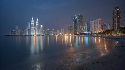 Obraz premium Stunning Kuala Lumpur Cityscape at Night with Reflections on Water, Beautiful Skyline and Urban Ambiance
