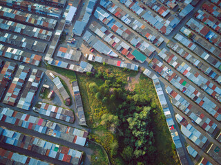Aerial top view landscape with garage roofs