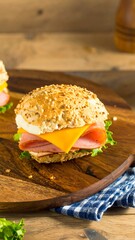 Close-up of a ham and cheese sandwich on a seeded bun