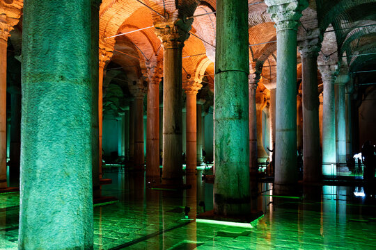 Interior view of the Basilica Cistern with illuminated columns and colorful lights, historic underground landmark in the old city of Istanbul, Turkiye.