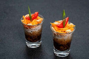 Bifum salad with chickpeas Delicious appetizers in shot glasses with fresh ingredients