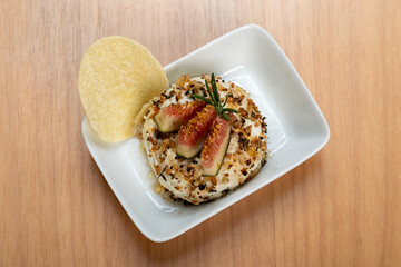 Cheese terrine Gourmet appetizer with figs, walnuts, and rosemary