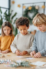 Three children engaged in creative craft activity, focused on assembling colorful decorations with various materials on a bright table, showcasing teamwork and artistic expression