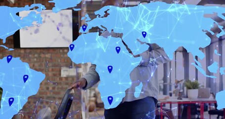 Businessman walking activating animated world map showing network retrieving smartphone - Powered by Adobe