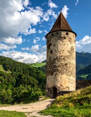 Stone tower amidst lush valley