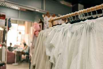 Fototapeta premium Clothing store with white shirts on display