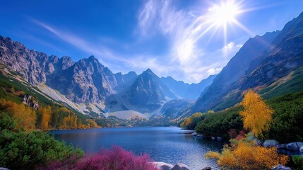 Vibrant Autumn Mountain Lake Landscape with Golden Trees and Bright Sunburst