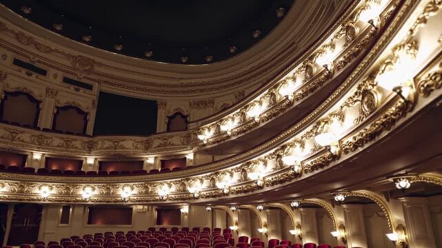 Elegant interior of historic theater showcasing ornate architecture and plush seating for upcoming performances