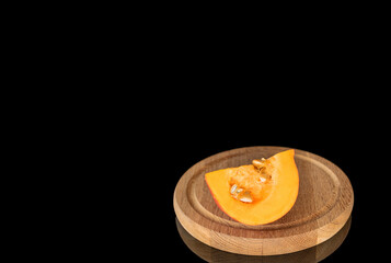 Ripe sweet pumpkins isolated on black background, close-up.