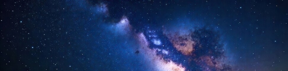 Deep blue night sky filled with countless bright stars and colorful nebulas