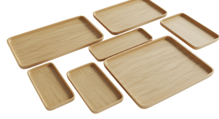 Collection of empty wooden trays of various sizes and shapes on a white background