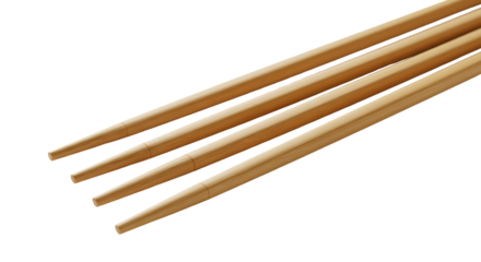Close-up of four wooden chopsticks arranged in a parallel pattern against a white background, highlighting their smooth texture and natural grain