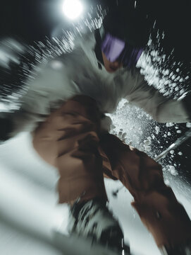 A skier speeding down a ski route from a mountain. Extreme winter activities and sports. Motion blur effect.