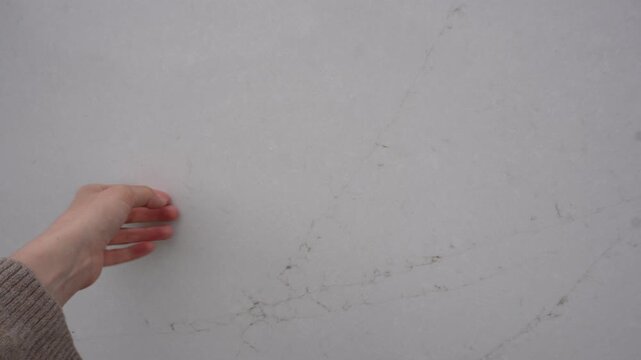Women hand touching stone