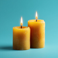 Burning beeswax candles wih blue background