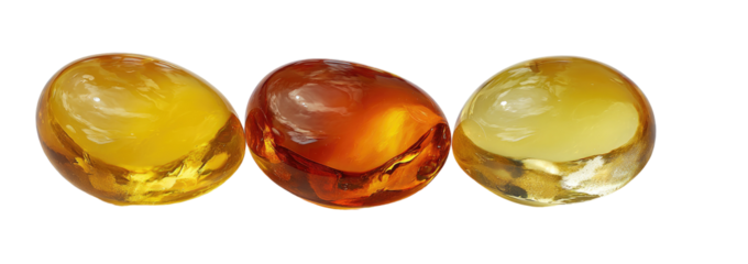 Three polished amber gemstones in varying shades