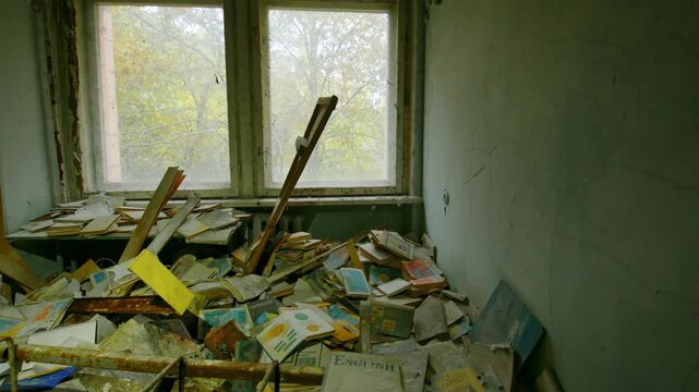 Footage captures the eerie and melancholic atmosphere of an abandoned school classroom in Pripyat, Ukraine, within the Chernobyl Exclusion Zone. Desks, chairs, books, and papers lie scattered and deca