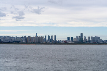 seaside city with skyscrapers and cloud