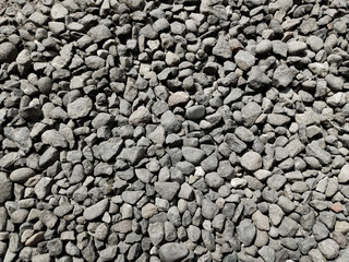 Abstract natural pebble stone background. Gray cobblestone texture. Stone background. Sea pebbles.
