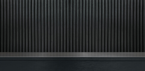 dark black or grey brushed stainless steel counter or table with dark black wood slats background, providing reflective surface ideal as a background for product displayed, industrial counter.