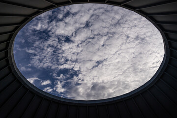 Fototapeta premium cloudy sky viewed through the ceiling hole of the observatory