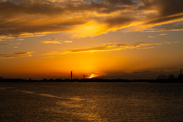 sunset over the sea with clouds