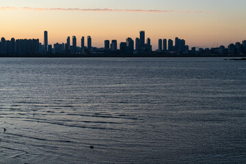 seaside city in dusk during sunset