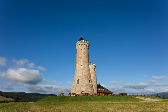 Dalimilova rozhledna, Dalimilova lookout tower, Vetrov, Stare Mesto pod Sneznikem, Jeseniky, Czech republic, Czechia. Historical lookout tower. Landmark architecture on the hill. Sunny summer.