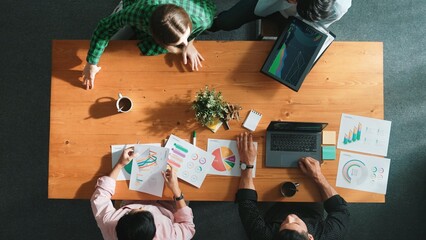 Top view of business team attend meeting while prepare working and analyzing data. Group of diverse people planning creative and working on start up project while team joining conference. Convocation.