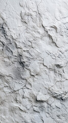 Fototapeta premium Detailed texture of a weathered rock surface, displaying cracks and intricate patterns