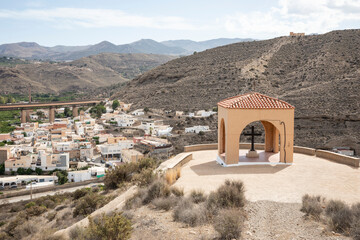 the Cross of May chapel with a view over Santa Fe de Mondujar town, Almeria, Andalusia, Spain