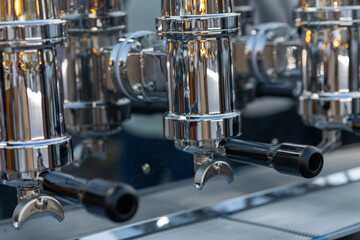 Aluminum Espresso Machines and Their Inputs in a Café
