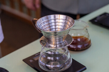 barista quick filter coffee brewing close up
