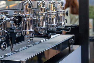 Aluminum Espresso Machines and Their Inputs in a Café
