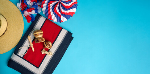 Chilean flag colors, traditional toys, huaso poncho and festive decorations create vibrant...