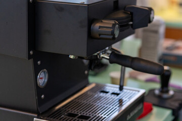 Aluminum Espresso Machines and Their Inputs in a Café
