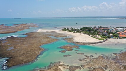 Fantastic panoramic view of Serrambi beach with coral reefs, natural swimming pools in the sea,...