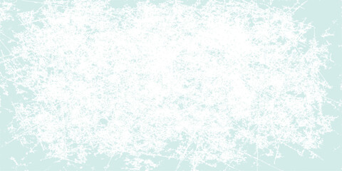 Abstract blue grunge background with a frozen winter snowflake pattern and texture