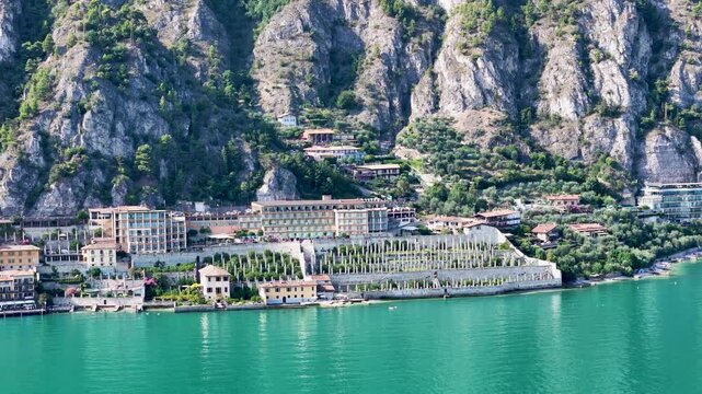 Limone sul Garda, Italy. Limonaia - the lemon terraces. Aerial 4K video footage of old lemon house in lake Garda. Drone view of lemon grove