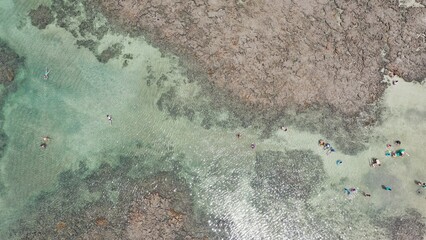 Fantastic panoramic view of Serrambi beach with coral reefs, natural swimming pools in the sea,...