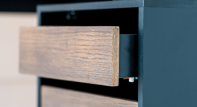 Opened drawer cabinet furniture wooden table at workplace