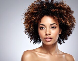 Woman with curly hair, neutral background
