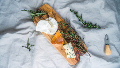 Flatlay of Assorted Cheeses with Fresh Herbs. Shavuot Jewish Festival. Generated Image