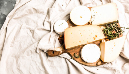 Flatlay of Assorted Cheeses with Fresh Herbs. Shavuot Jewish Festival. Generated Image