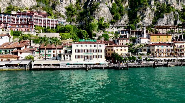 Limone sul Garda old town. Aerial 4K video footage of panoramic lake Garda and Italian Alps mountains. Lombardy drone landscape of downtown
