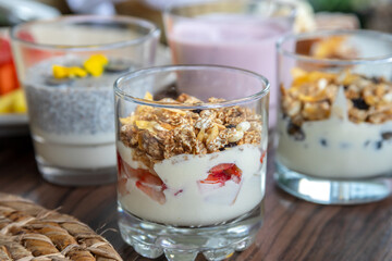 variety of breakfast items, breads, eggs, waffles, cereals, and cheeses