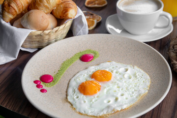 variety of breakfast items, breads, eggs, waffles, cereals, and cheeses